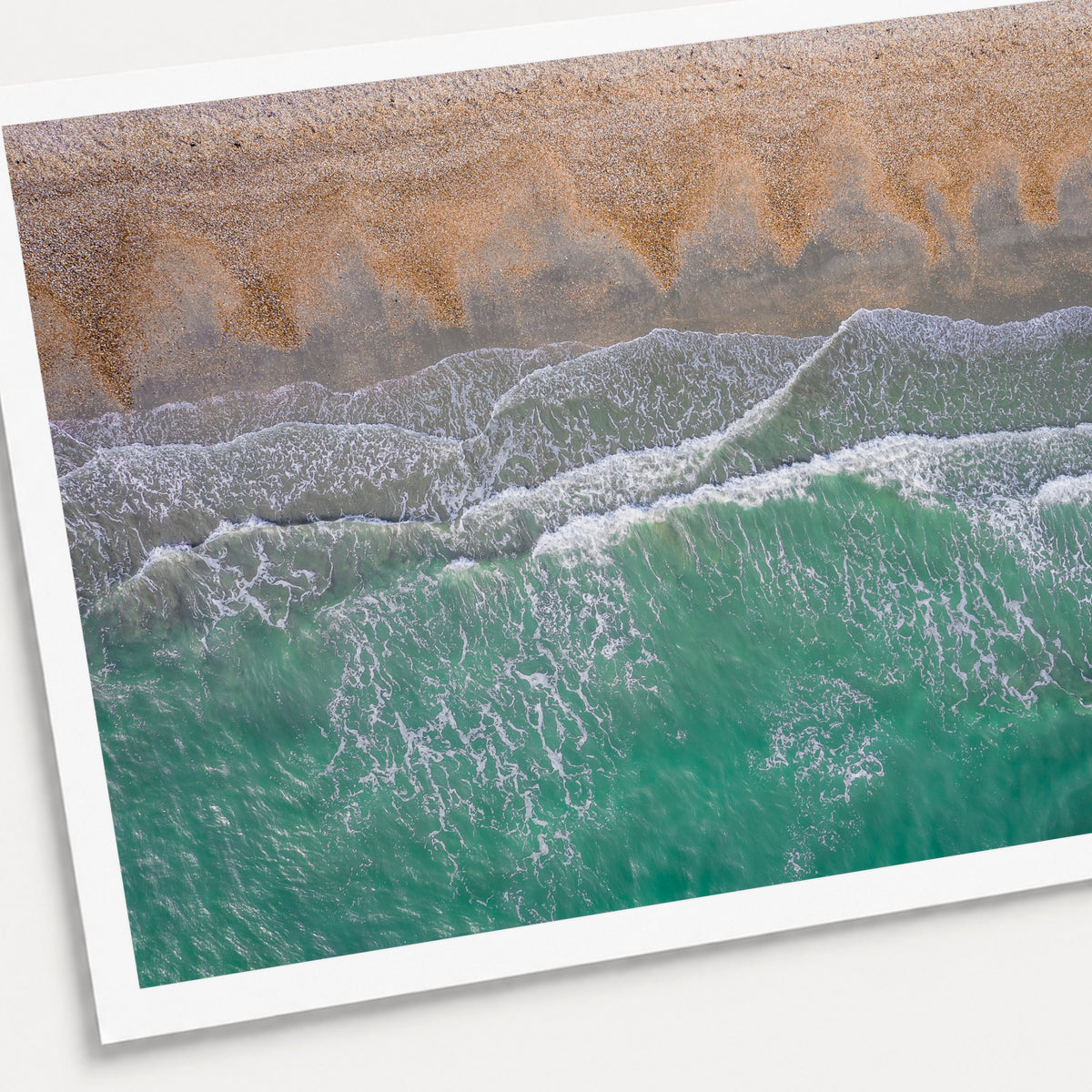 A photographic print of Breaking Emerald, shown with a white border and angled presentation on a light background.