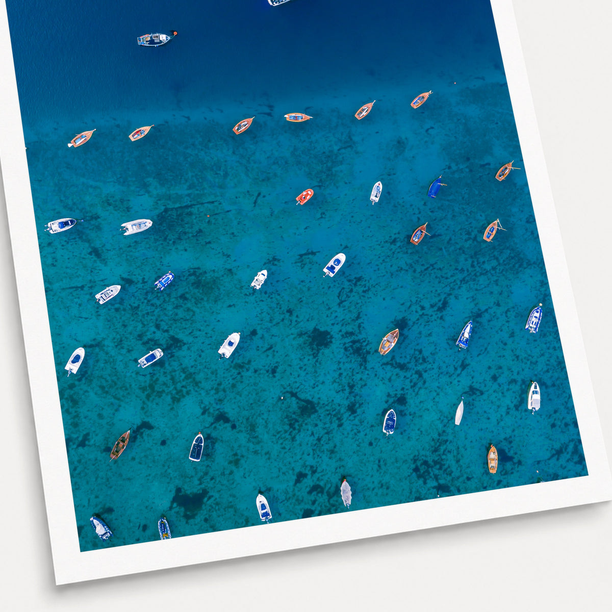 A photographic print of Teetering on the Edge, shown with a white border and angled presentation on a light background.
