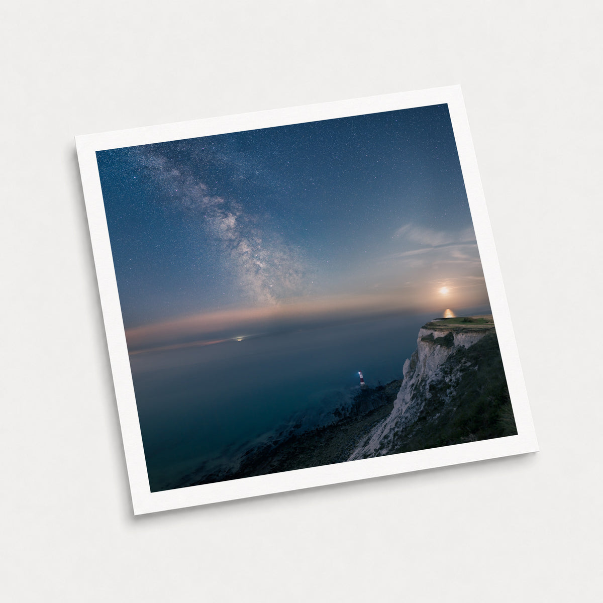 A photographic art print of Beachy Head Milky Way, displayed at an angle on a light gray background.