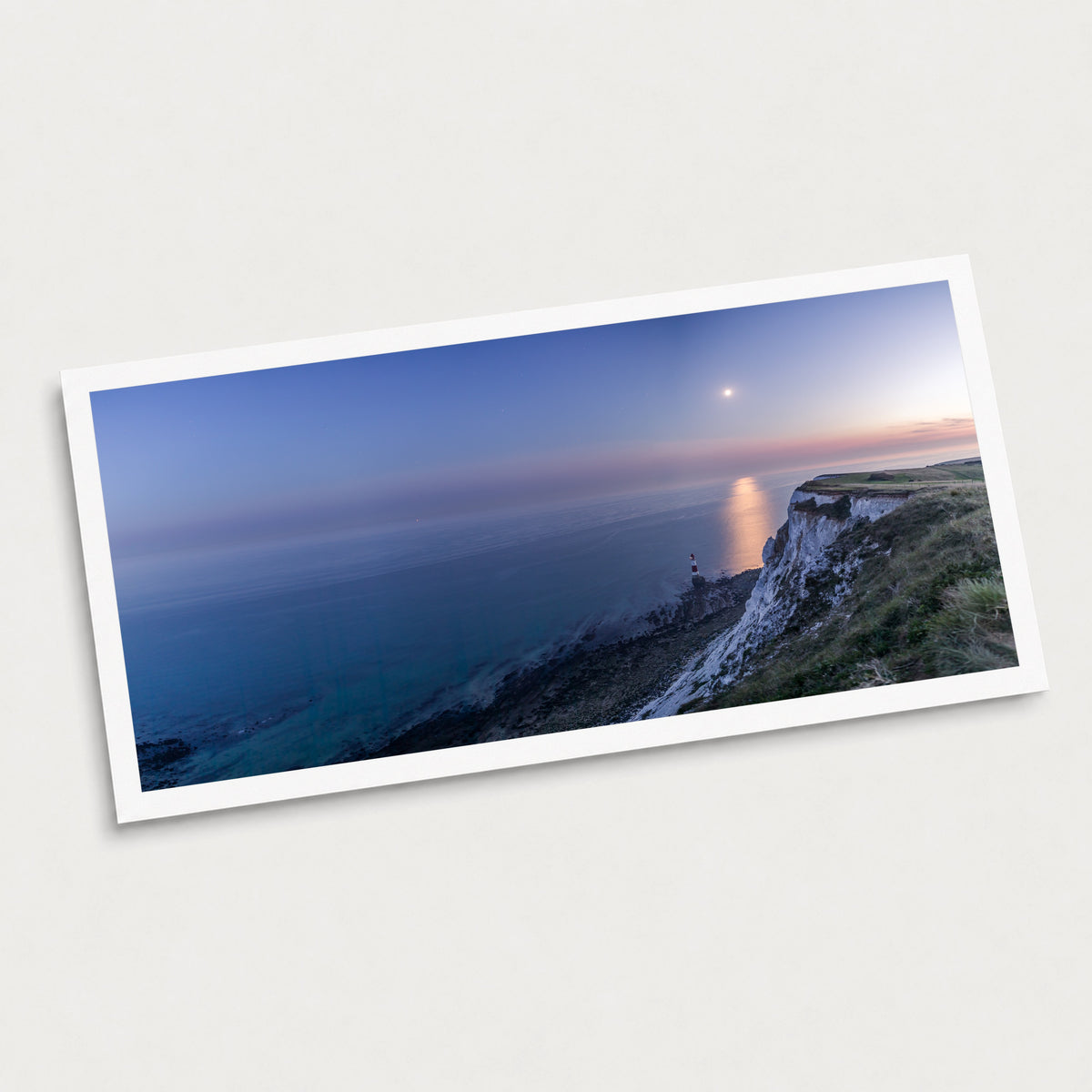A photographic art print of Beachy Head Moonrise, displayed at an angle on a light gray background.