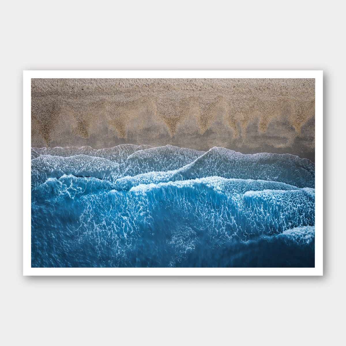 A photographic print of Breaking Blue, framed with a white border and shown against a light gray background.