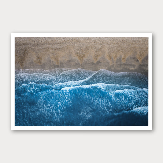A photographic print of Breaking Blue, framed with a white border and shown against a light gray background.
