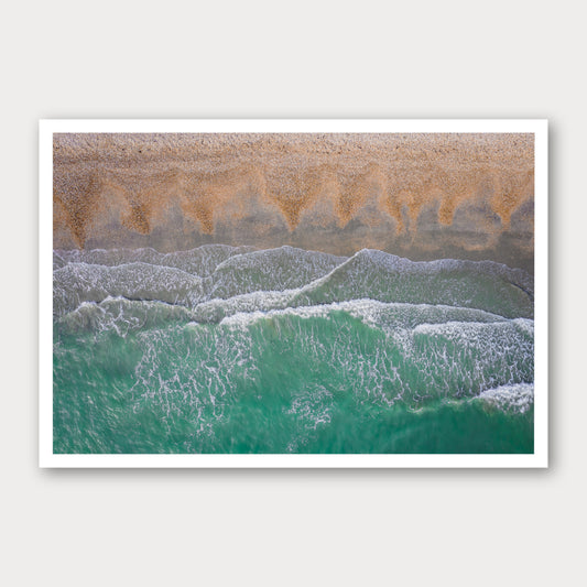 A photographic print of Breaking Emerald, framed with a white border and shown against a light gray background.