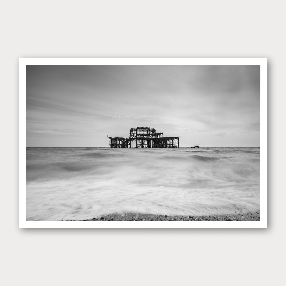 A photographic print of Brighton Old Pier, framed with a white border and shown against a light gray background.
