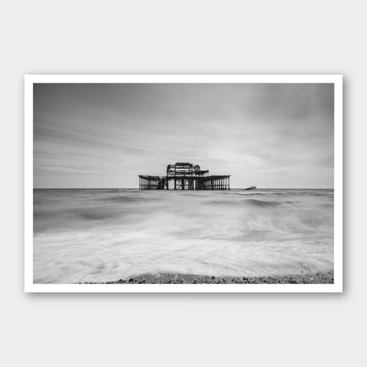 A photographic print of Brighton Old Pier, framed with a white border and shown against a light gray background.