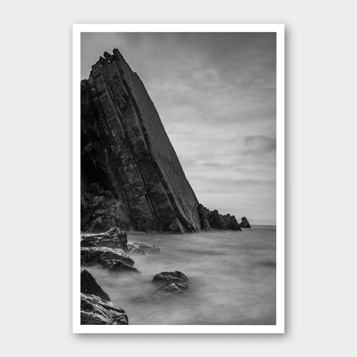 A black and white photographic print of Dragon's Back, framed with a white border and shown against a light gray background.
