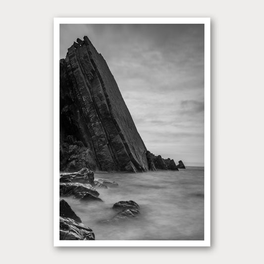 A black and white photographic print of Dragon's Back, framed with a white border and shown against a light gray background.