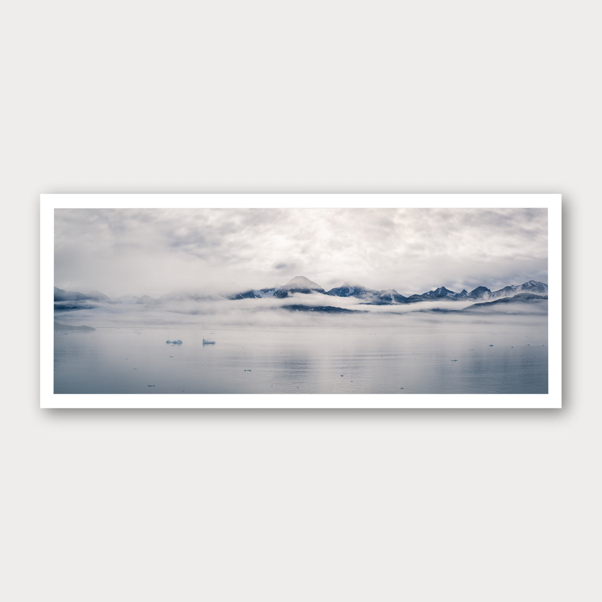 A photographic print of Glacial Waters, framed with a white border and shown against a light gray background.