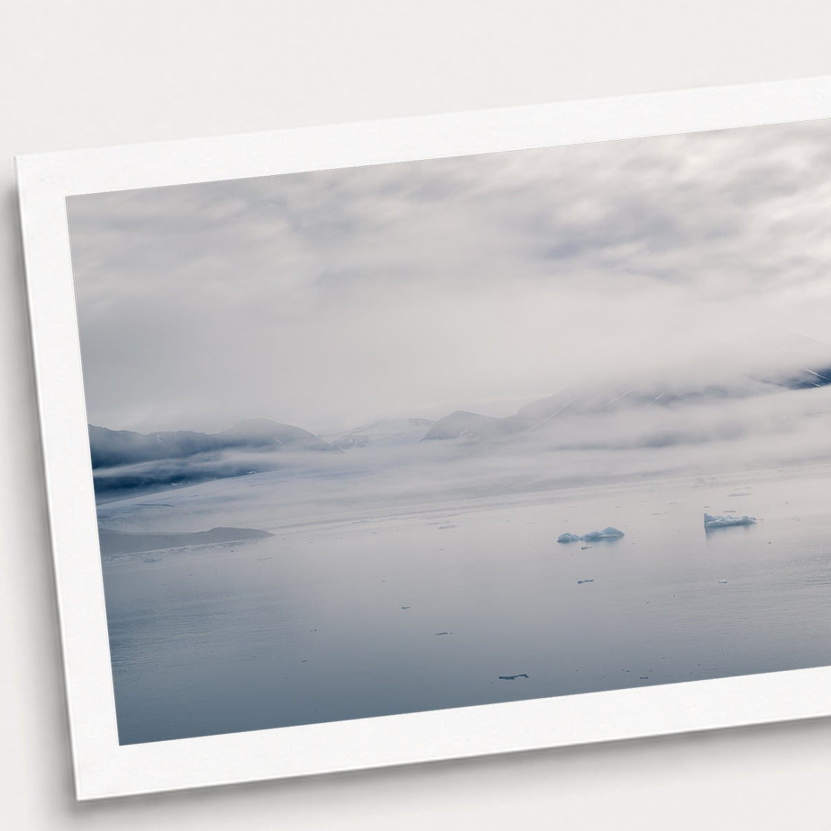 A photographic print of Glacial Waters, shown with a white border and angled presentation on a light background.