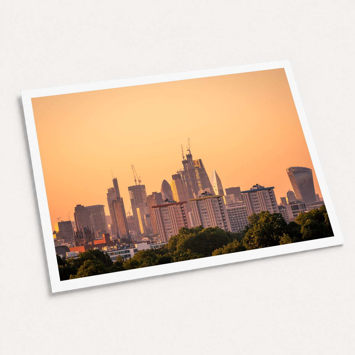 A photographic art print of Golden City, displayed at an angle on a light gray background.