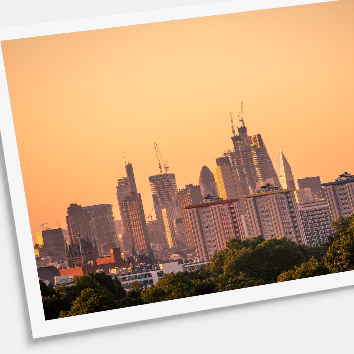 A photographic print of Golden City, shown with a white border and angled presentation on a light background.