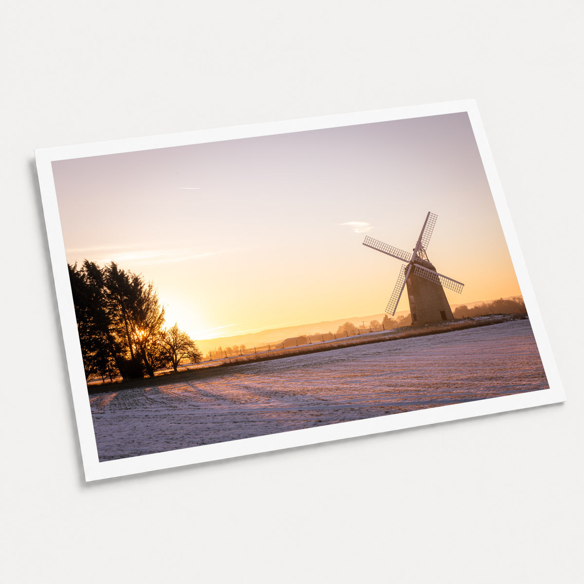 A photographic art print of Great Haseley Sunrise, displayed at an angle on a light gray background.