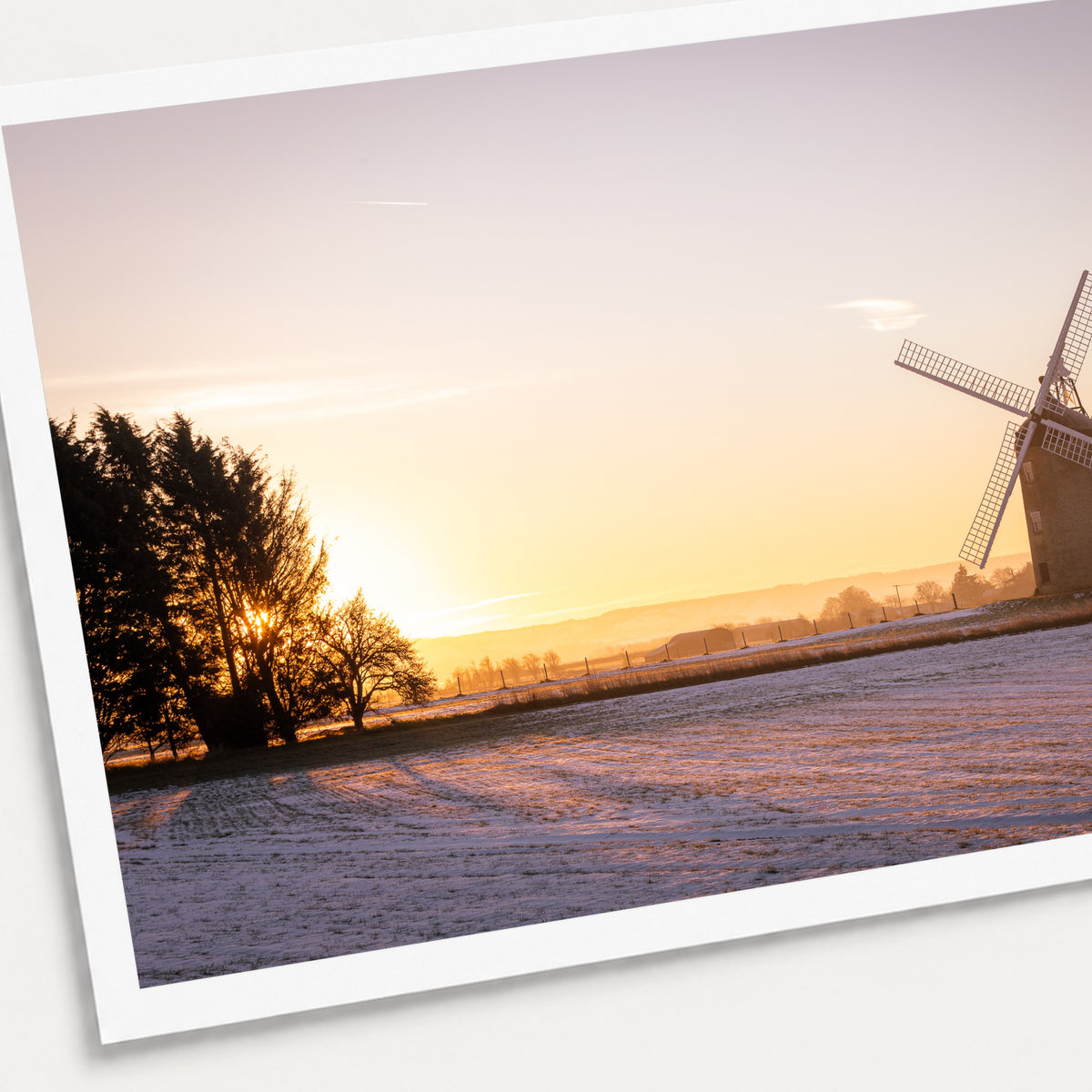 A photographic print of Great Haseley Sunrise, shown with a white border and angled presentation on a light background.
