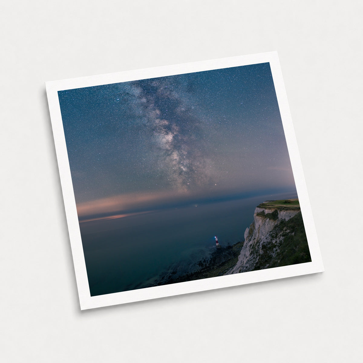 A photographic art print of Guiding Light, displayed at an angle on a light gray background.