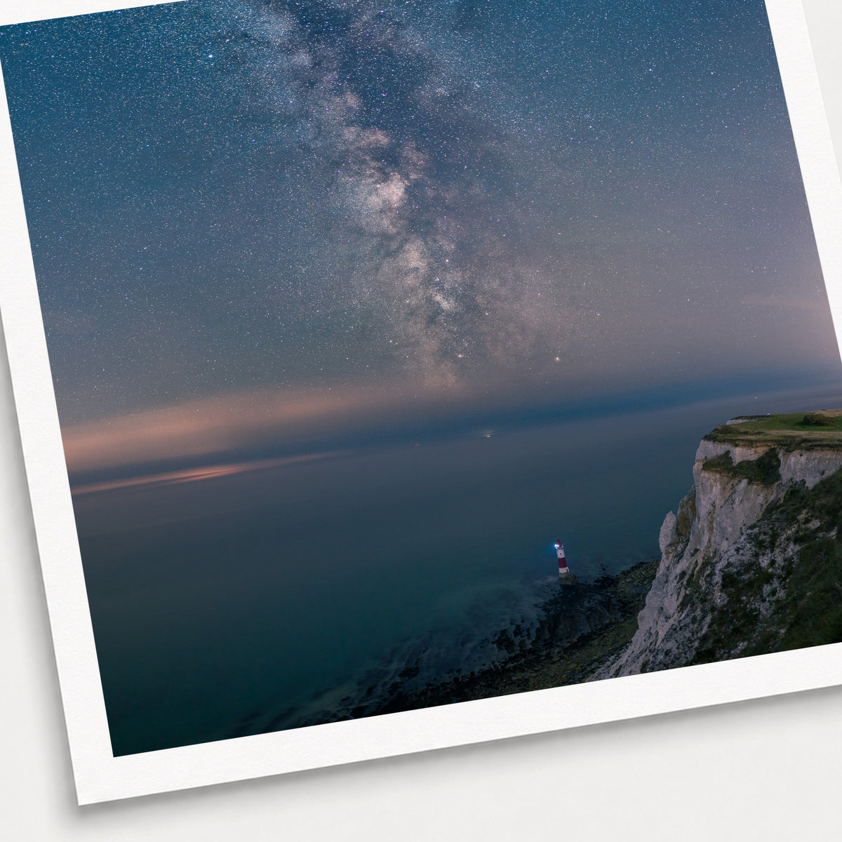 A photographic print of Guiding Light, shown with a white border and angled presentation on a light background.