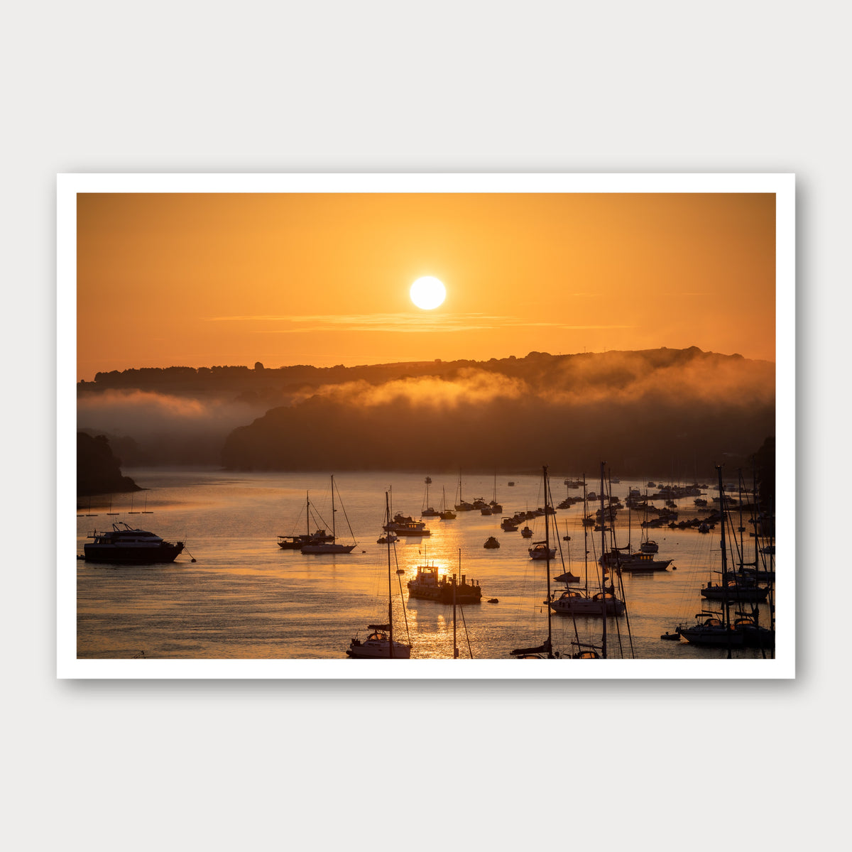 A photographic print of Harbour Sunrise, framed with a white border and shown against a light gray background.