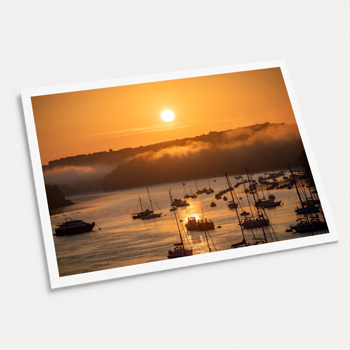 A photographic art print of Harbour Sunrise, displayed at an angle on a light gray background.