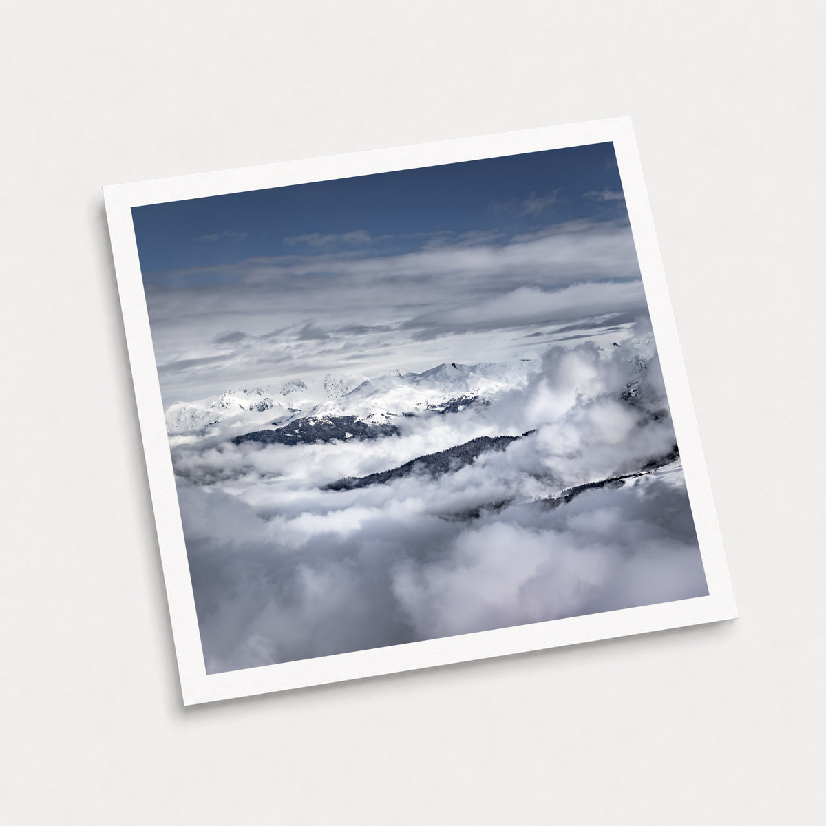 A photographic art print of Islands in the Sky, displayed at an angle on a light gray background.