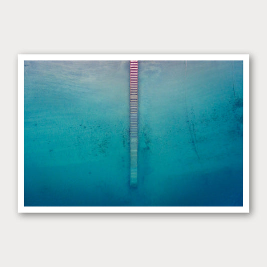 A photographic print of Jetty from Above, framed with a white border and shown against a light gray background.