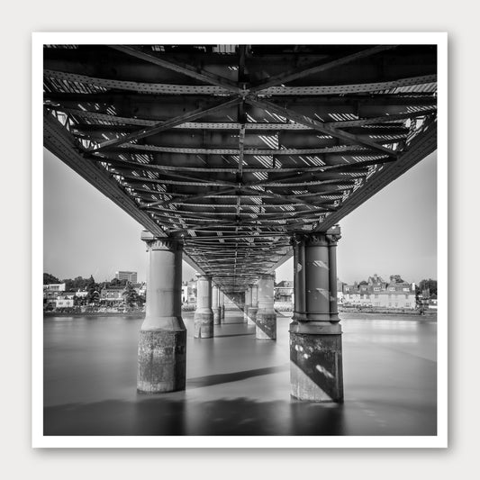 A photographic print of Kew Railway Bridge, framed with a white border and shown against a light gray background.