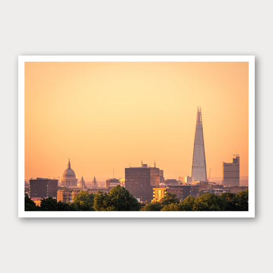 A photographic print of London Sunrises, framed with a white border and shown against a light gray background.
