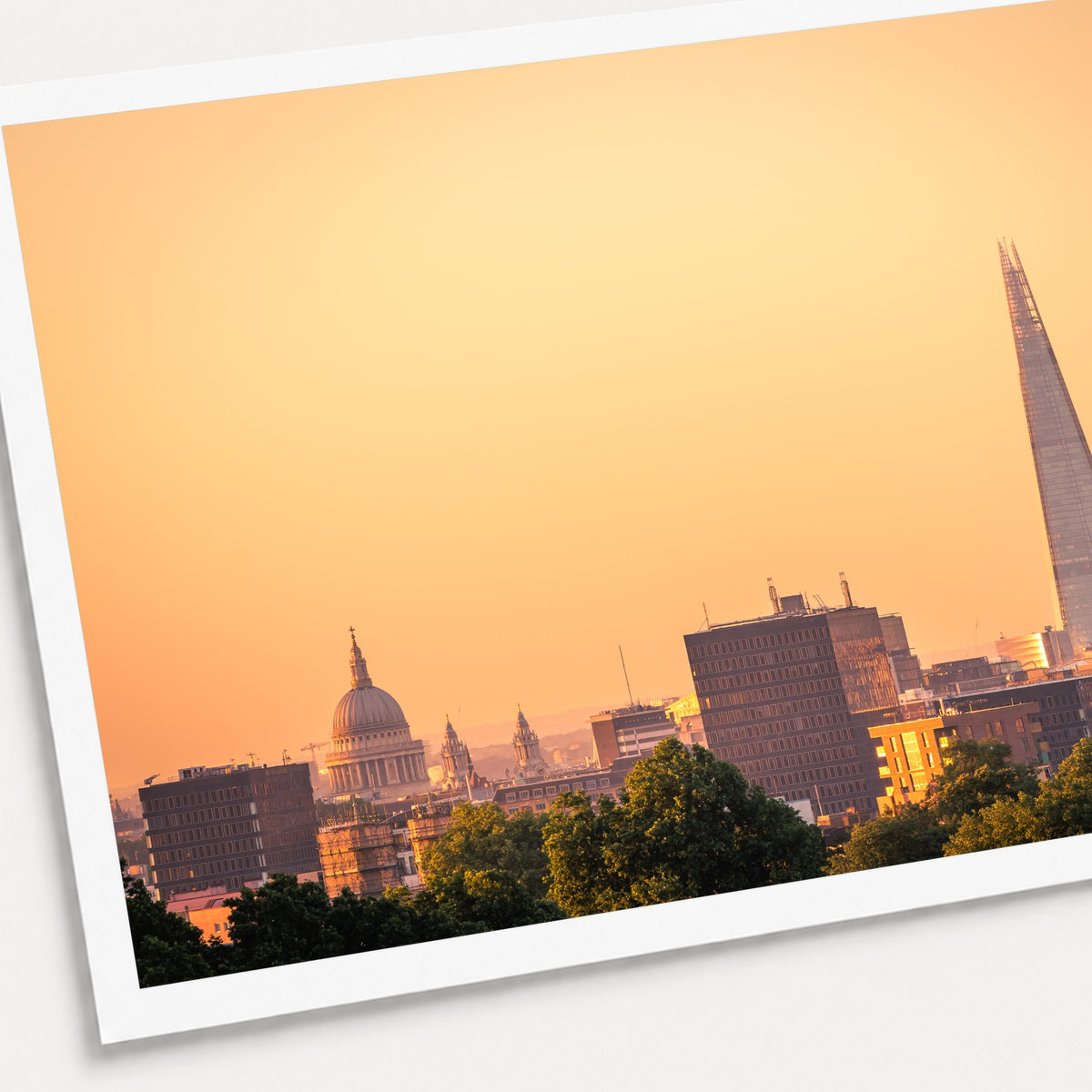 A photographic print of London Sunrises, shown with a white border and angled presentation on a light background.
