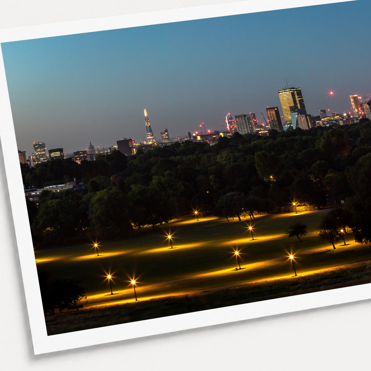 A photographic print of Looking Over London, shown with a white border and angled presentation on a light background.