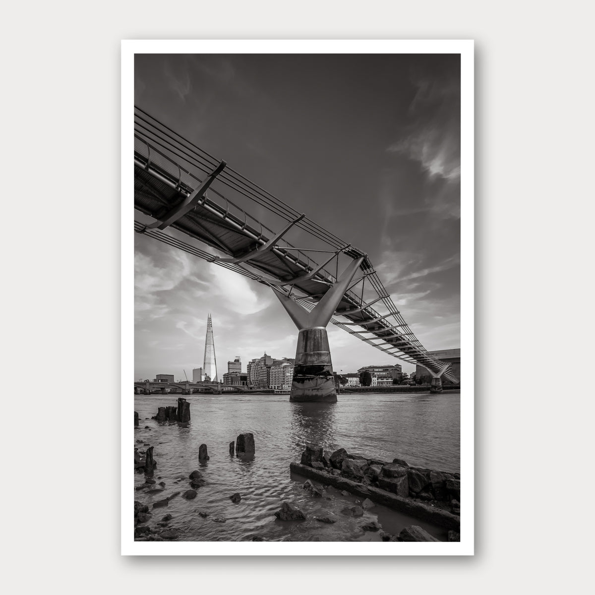 A black and white photographic print of Low Tide, framed with a white border and shown against a light gray background.