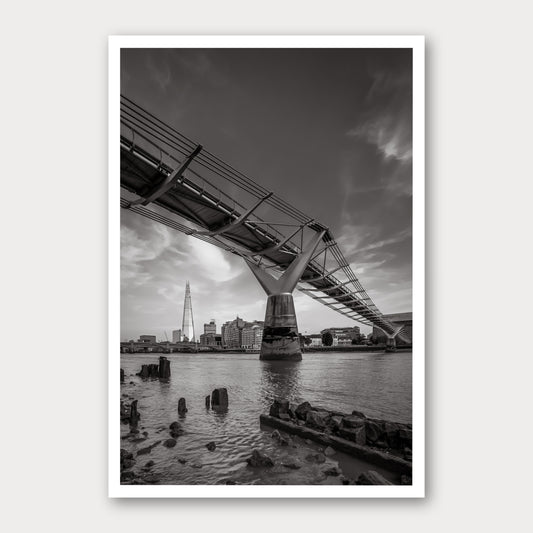 A black and white photographic print of Low Tide, framed with a white border and shown against a light gray background.