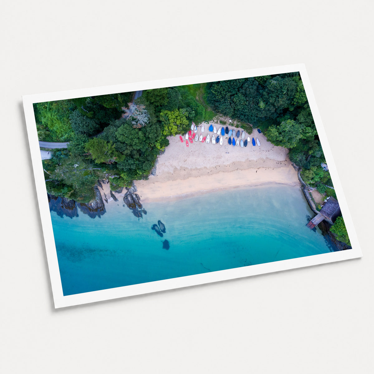 A photographic art print of Mill Bay, displayed at an angle on a light gray background.