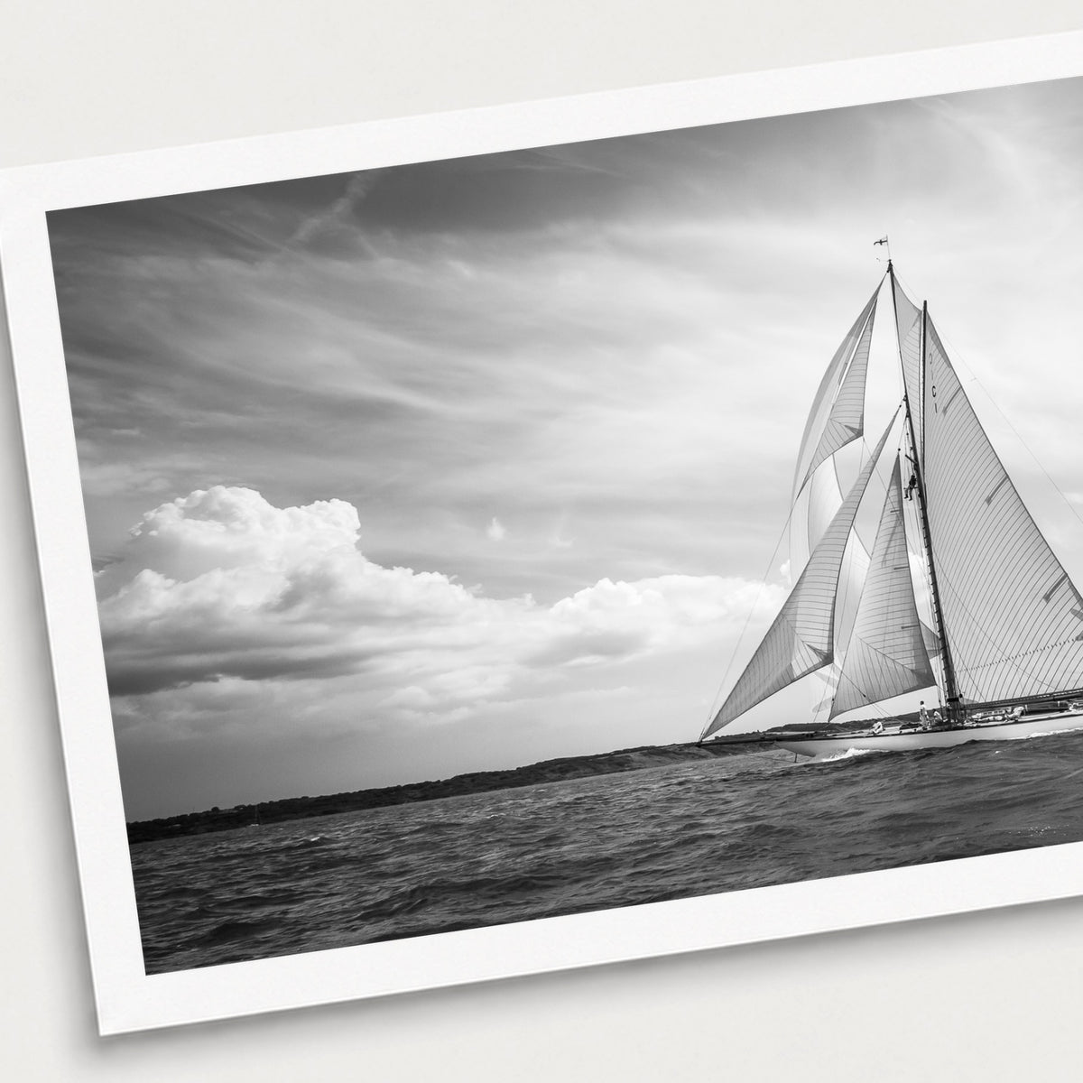 A black and white photographic print of Plain Sailing, shown with a white border and angled presentation on a light background.