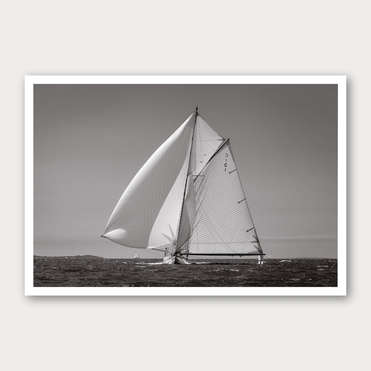 A black and white photographic print of Running with the Wind, framed with a white border and shown against a light gray background.