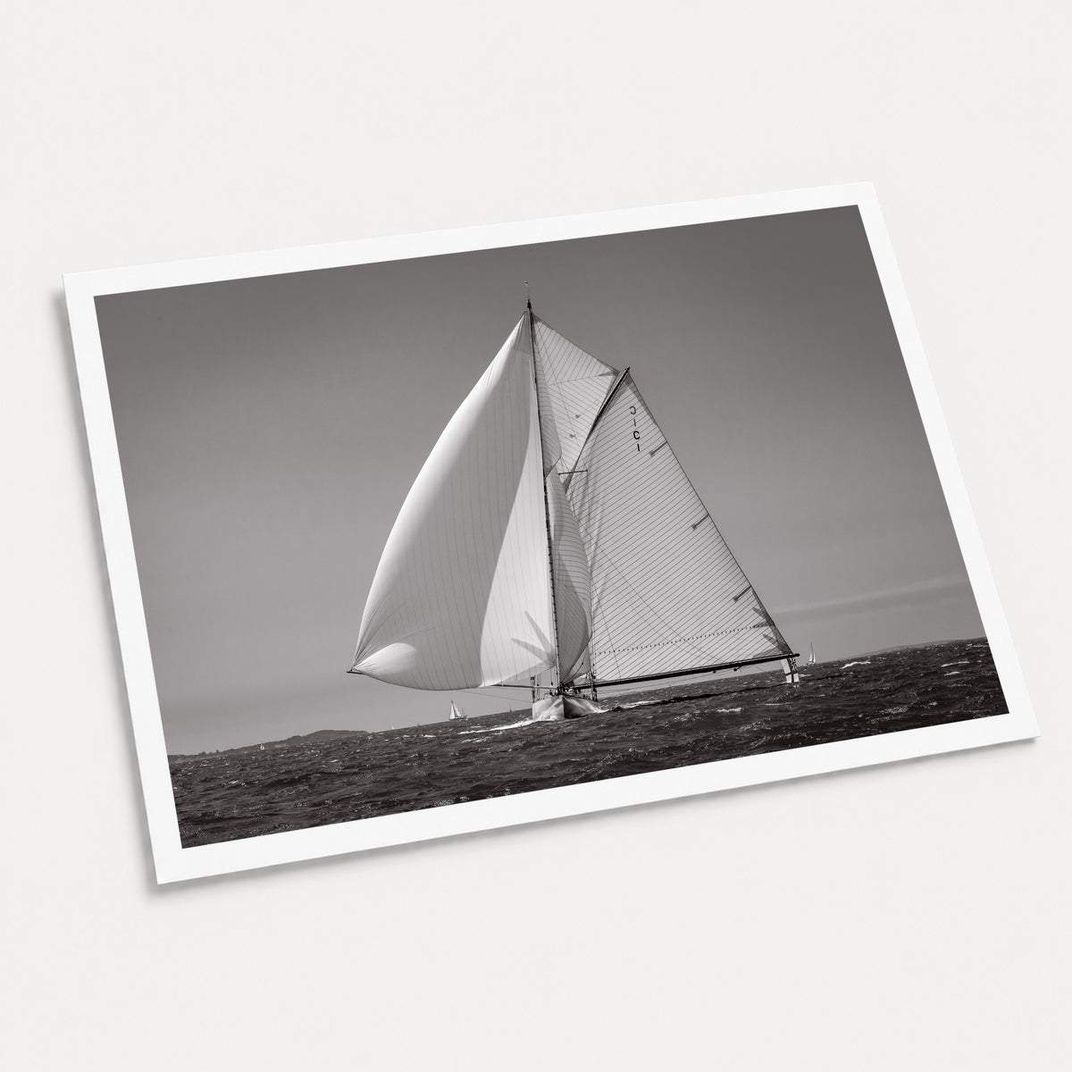 A black and white photographic art print of Running with the Wind, displayed at an angle on a light gray background.