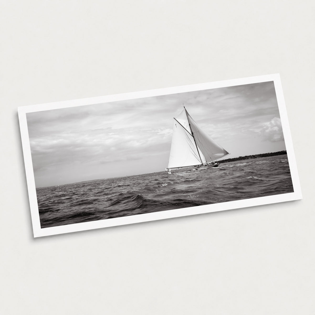 A black and white photographic art print of Sail Away, displayed at an angle on a light gray background.