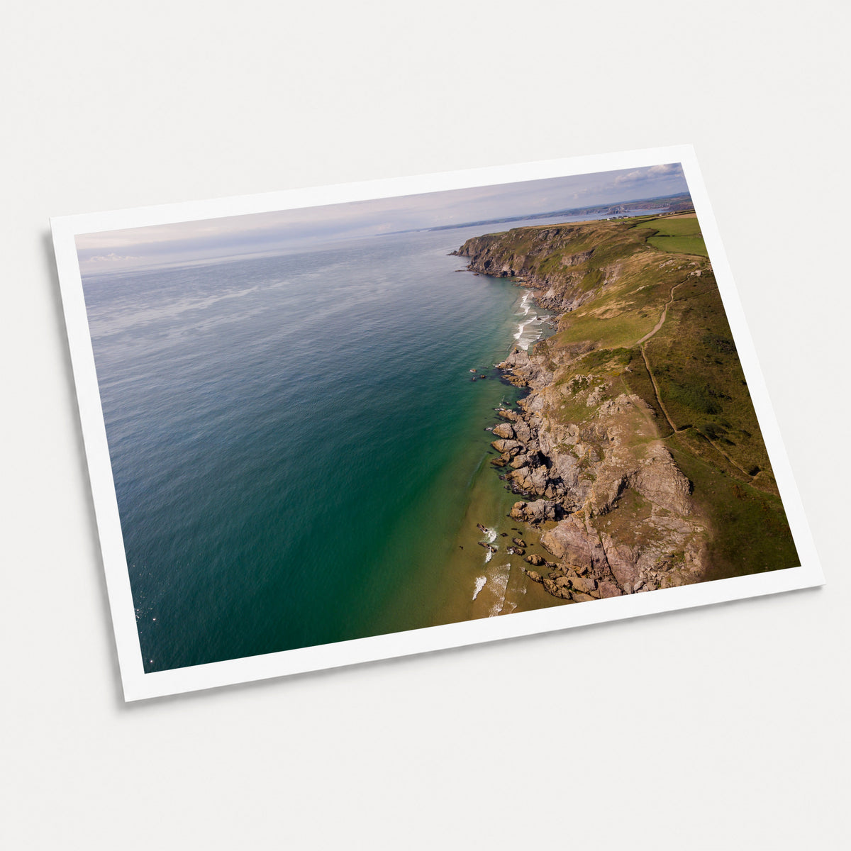 A photographic art print of Salcombe Coastline, displayed at an angle on a light gray background.