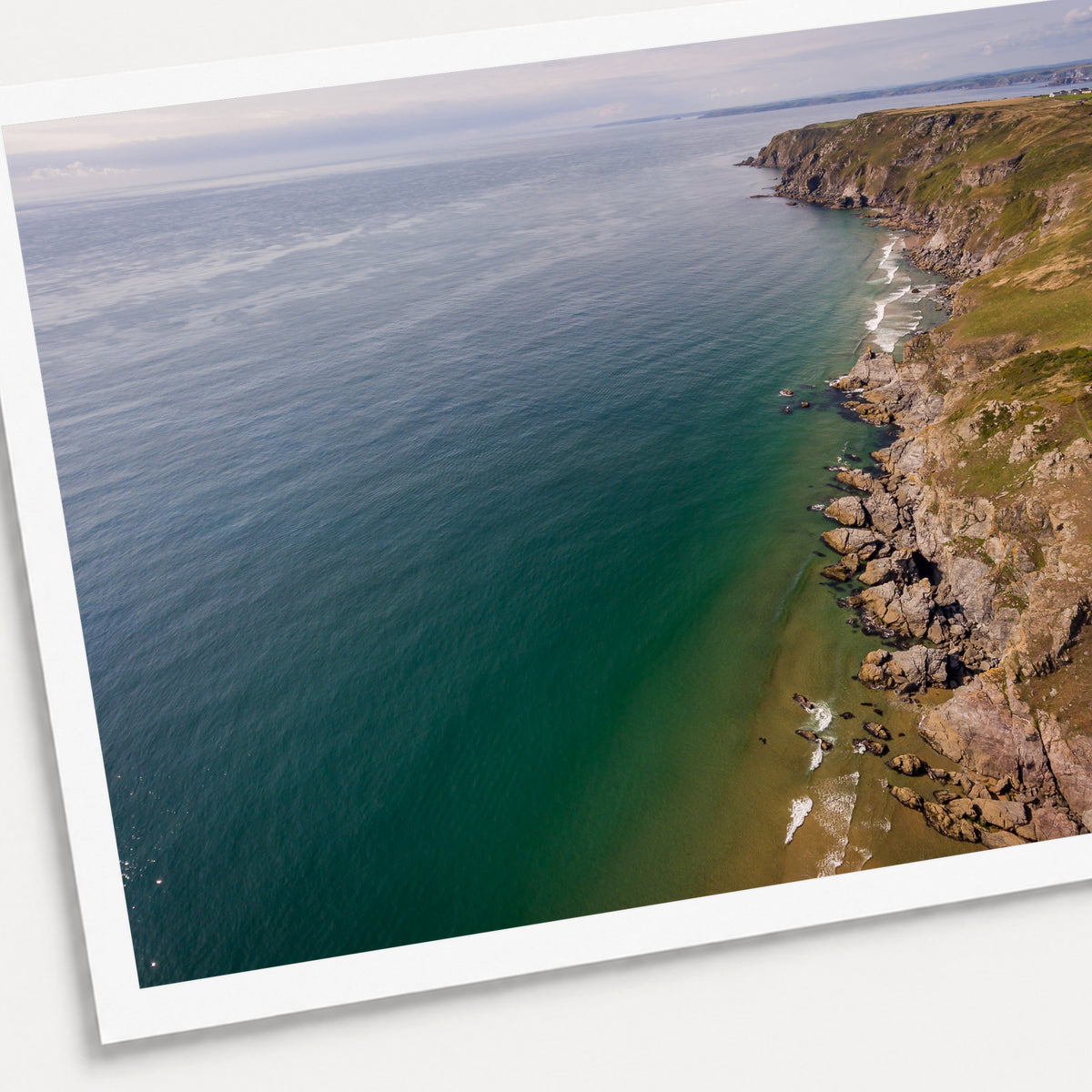 A photographic print of Salcombe Coastline, shown with a white border and angled presentation on a light background.
