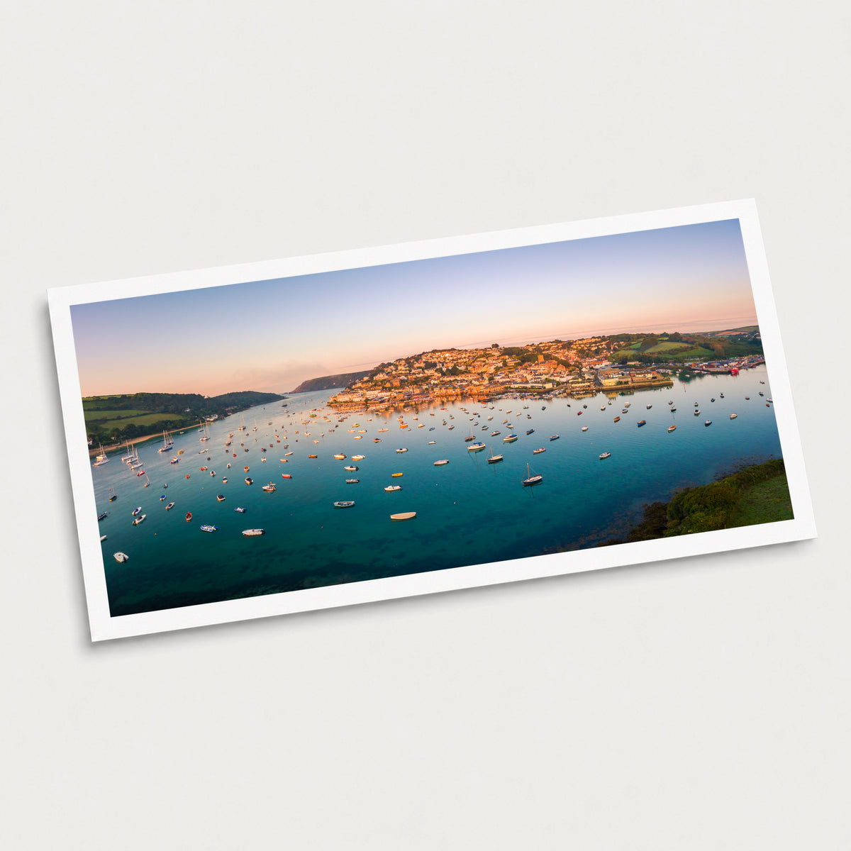 A photographic art print of Salcombe Sunrise, displayed at an angle on a light gray background.