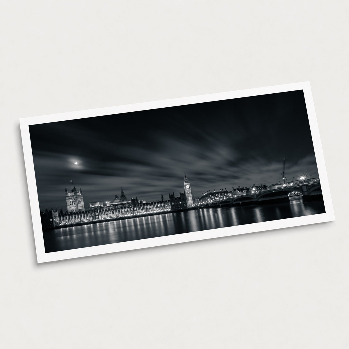 A black and white photographic art print of Sightseeing, displayed at an angle on a light gray background.