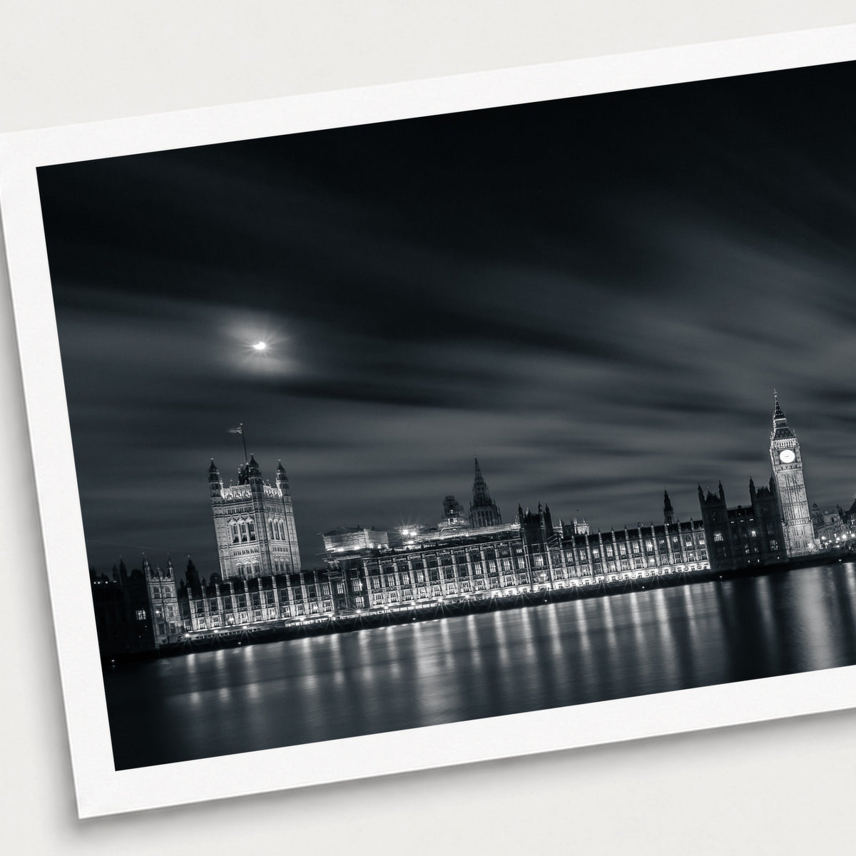 A black and white photographic print of Sightseeing, shown with a white border and angled presentation on a light background.