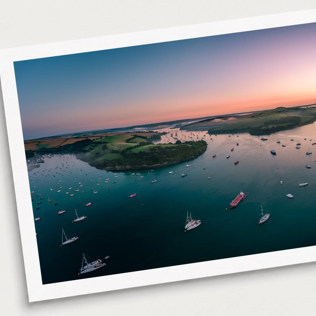 A photographic print of Snapes Point First Light, shown with a white border and angled presentation on a light background.