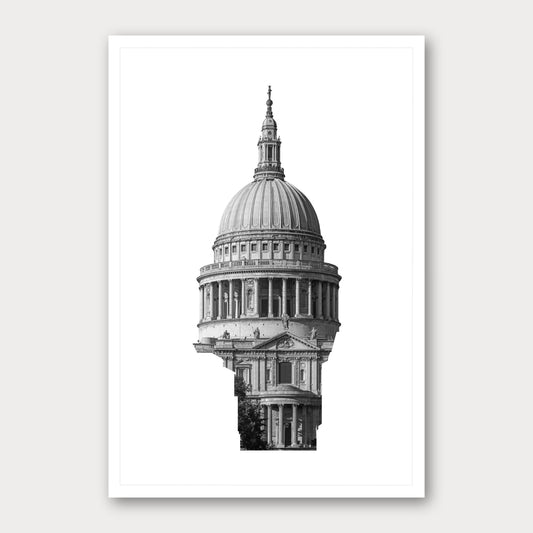 A black and white photographic print of St Paul's Cathedral, framed with a white border and shown against a light gray background.