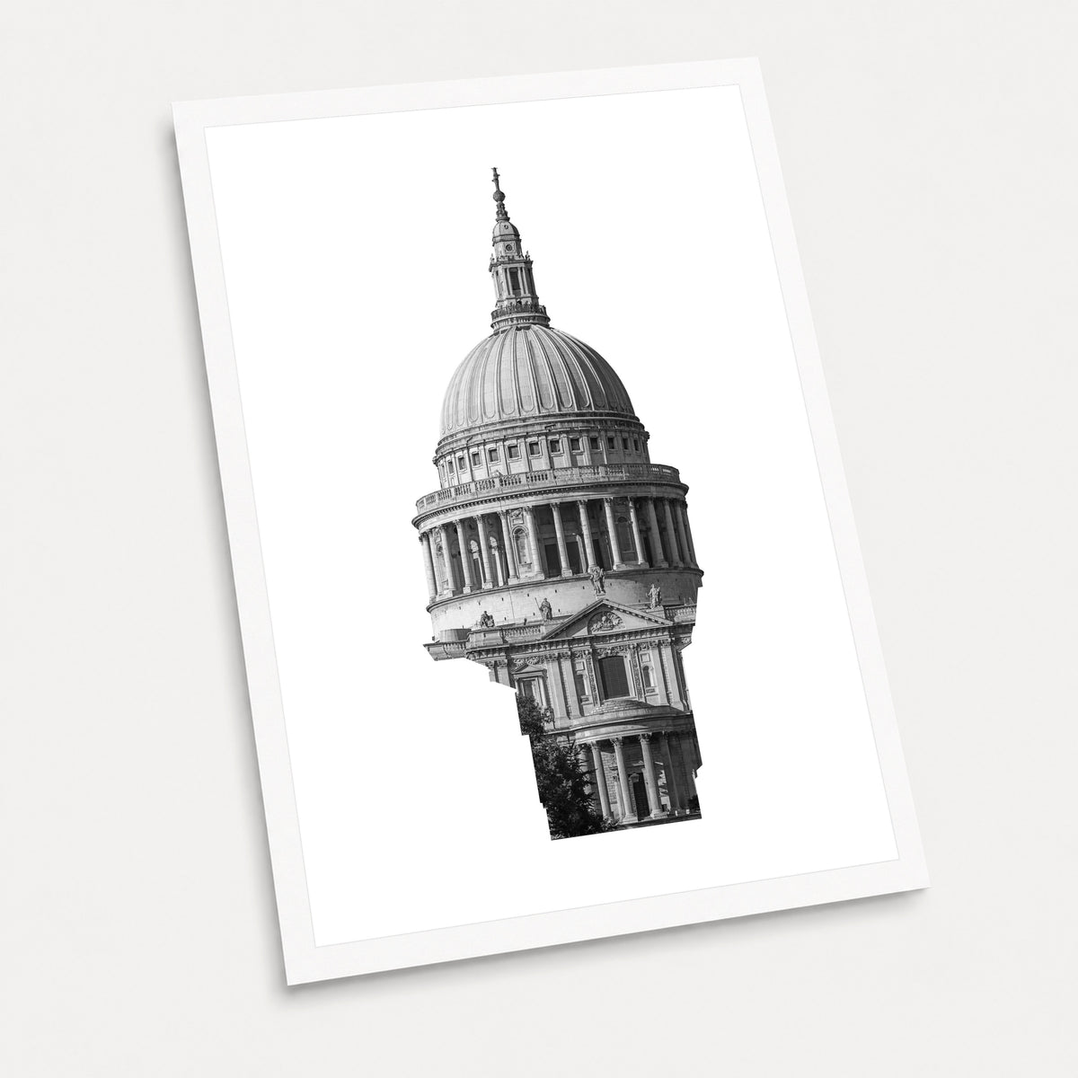 A black and white photographic art print of St Paul's Cathedral, displayed at an angle on a light gray background.