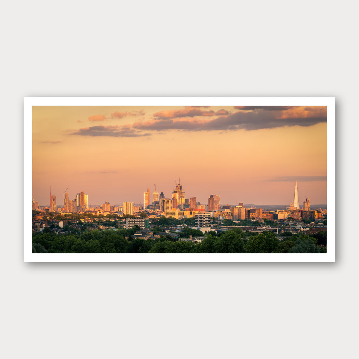 A photographic print of Sunrise Skyline, framed with a white border and shown against a light gray background.