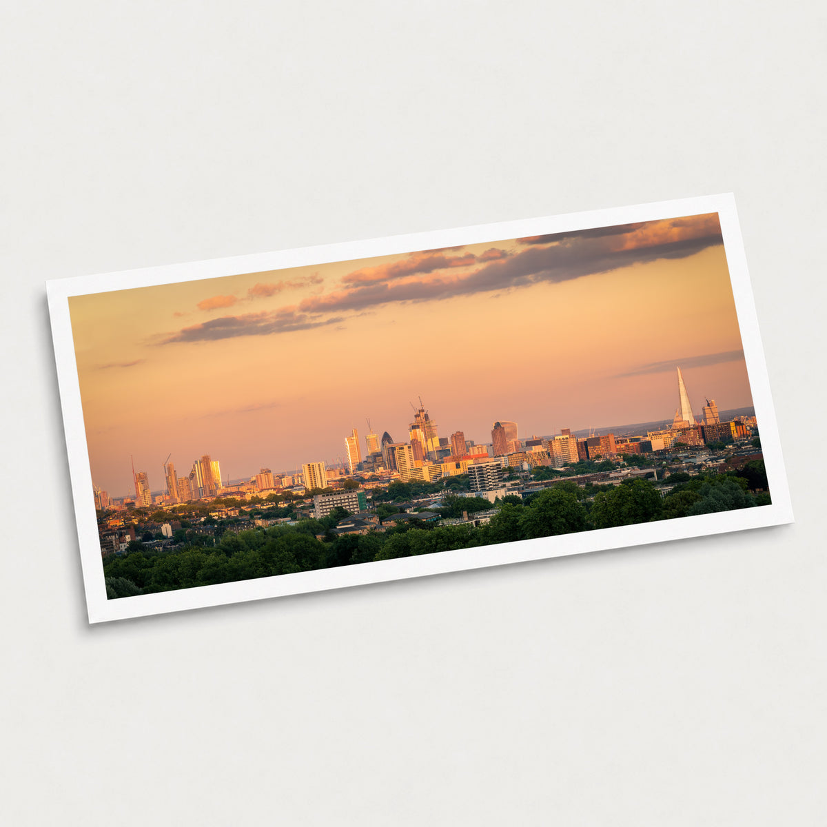 A photographic art print of Sunrise Skyline, displayed at an angle on a light gray background.