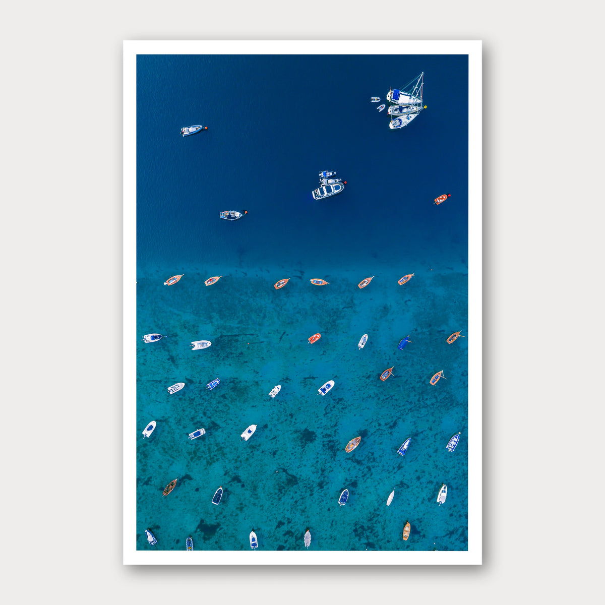 A photographic print of Teetering on the Edge, framed with a white border and shown against a light gray background.