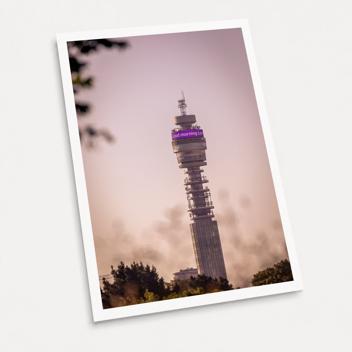 A photographic art print of The BT Tower at Dawn, displayed at an angle on a light gray background.