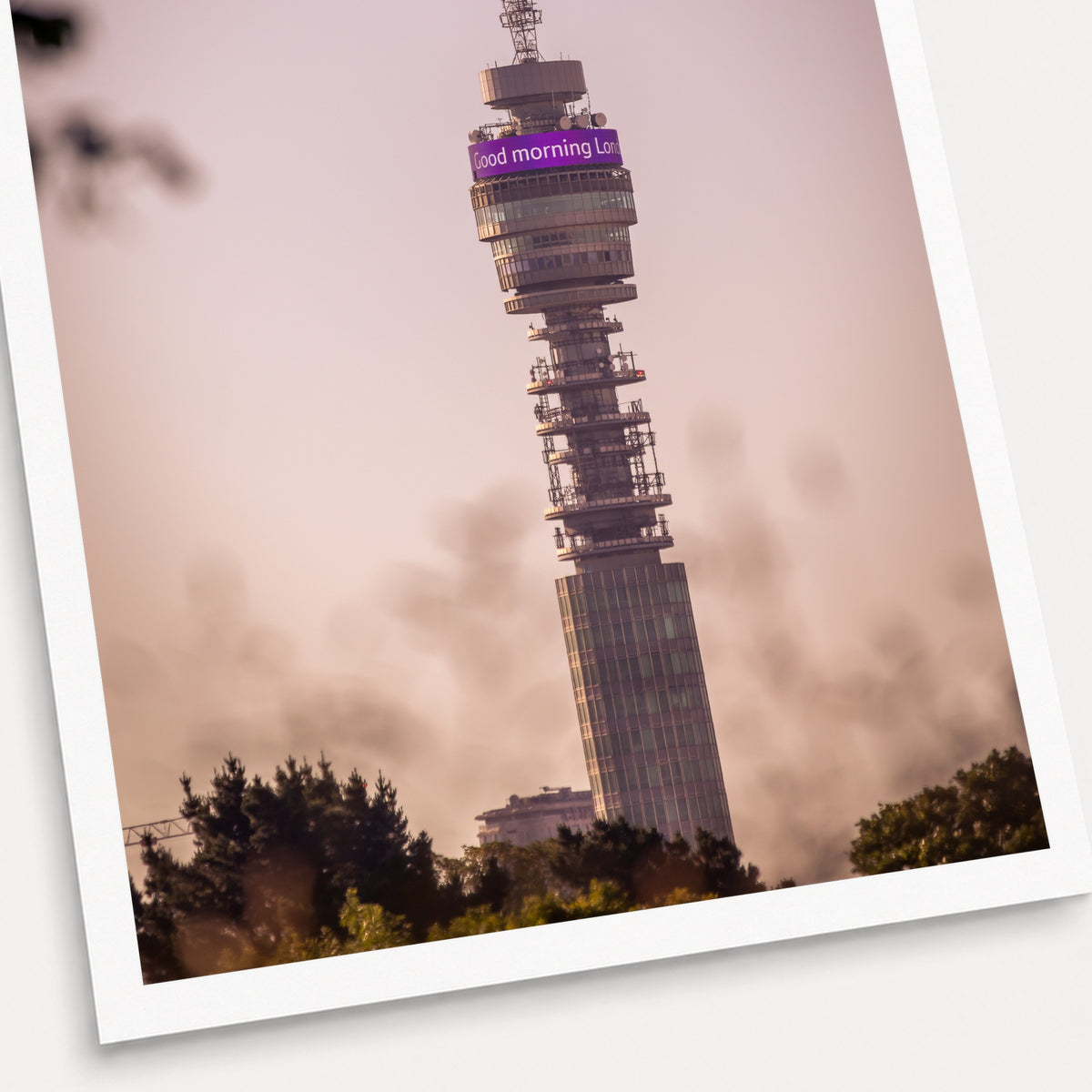 A photographic print of The BT Tower at Dawn, shown with a white border and angled presentation on a light background.