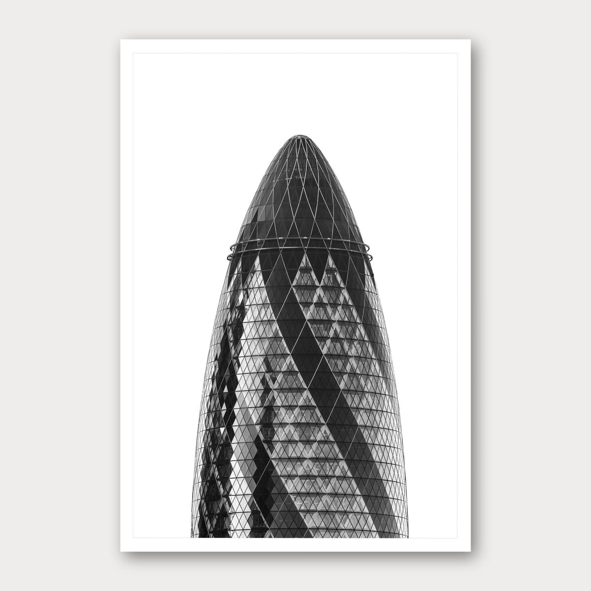A black and white photographic print of The Gherkin, framed with a white border and shown against a light gray background.