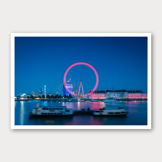 A photographic print of The London Eye, framed with a white border and shown against a light gray background.