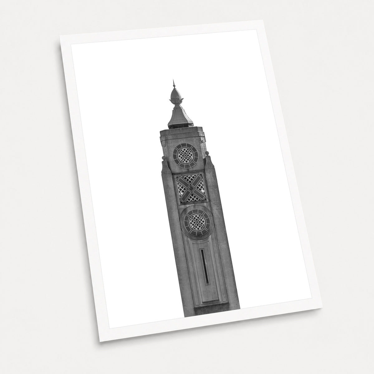 A black and white photographic art print of The Oxo Tower, displayed at an angle on a light gray background.